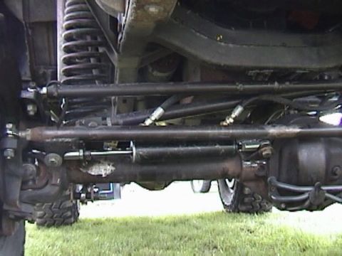 1995 Ford Bronco - Undercarriage view shows the steering system and suspension components of a 4x4 vehicle.