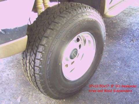 2001 Ford Excursion - Close-up of a tire and wheel assembly, showing the tread pattern and rim details.