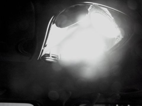 2001 Ford Excursion - The interior dome light's lens appears to be cracked, obscuring the light source.
