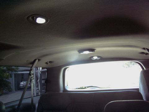 2001 Ford Excursion - Interior of a 2001 Ford Excursion, showing the headliner and rear window area.