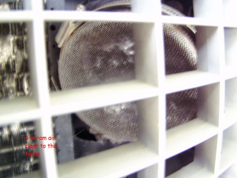 2001 Ford Excursion - The image shows a close-up of a white grille with mesh screens, likely part of an air intake system.
