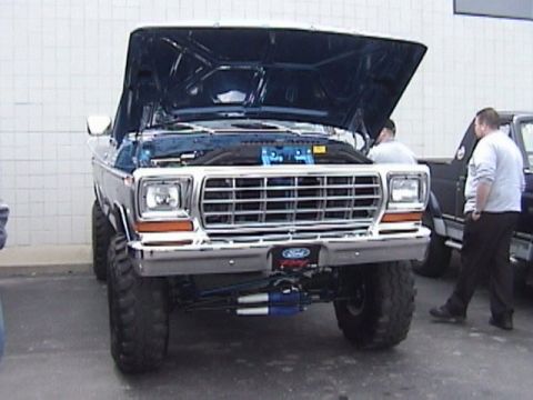 1995 Ford Bronco - This lifted 1979 Ford F-Series truck is shown with its hood open, revealing the engine bay.