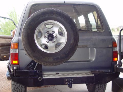 1993 Ford Bronco - This SUV's rear features a spare tire, custom bumper, and tow hitch.