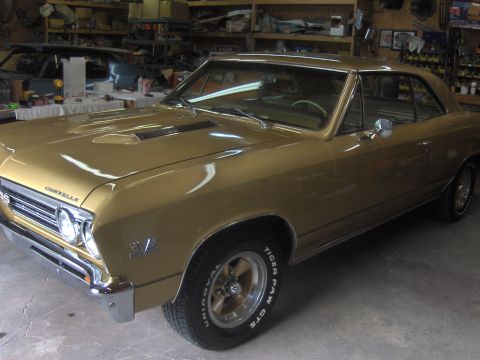 1970 Chevrolet Camaro - Gold 1967 Chevrolet Chevelle SS coupe with SS badging and hood scoops.