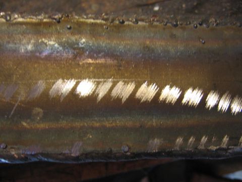 1989 Ford Bronco - Detail of metalwork, showing a series of parallel welding marks.