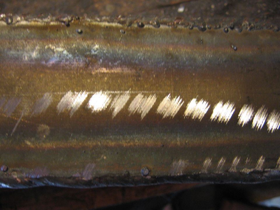 Close-up of welding marks on a metallic surface