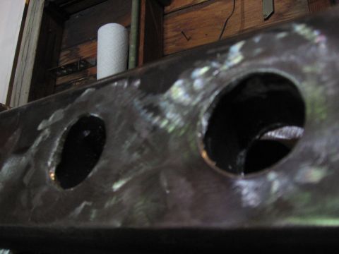 1989 Ford Bronco - Metal frame with holes, likely a component from a vehicle or machinery.