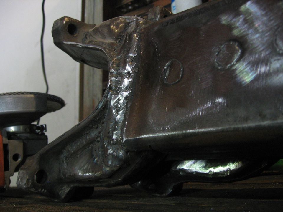 Welded metal component with rough welds and circular indentations