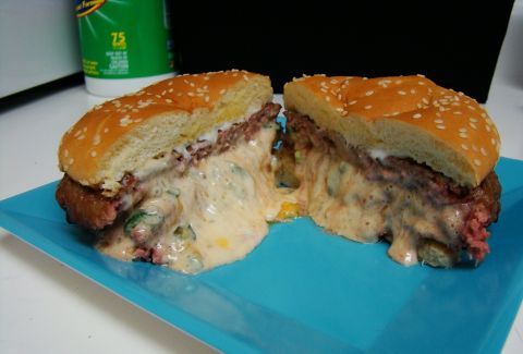 1989 Ford Bronco - A juicy cheeseburger, cut in half, reveals a generous amount of melted cheese and a thick beef patty.