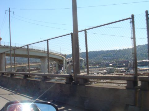 1992 Ford Bronco - Highway interchange and cityscape viewed from a moving vehicle.