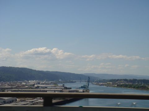 1992 Ford Bronco - Industrial waterfront scene with cranes and buildings along a river.