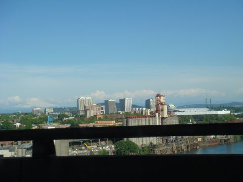 1992 Ford Bronco - View of a city and industrial area with mountains in the background.