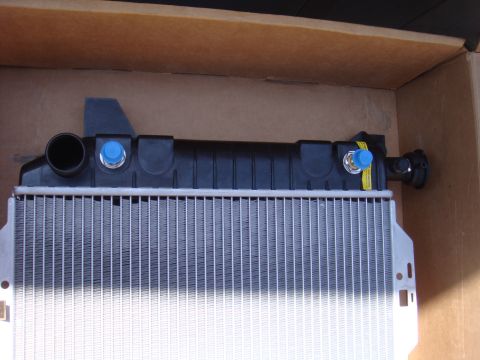 1992 Ford Bronco - New radiator for sale, part number not visible. Supermotors.net logo is present.