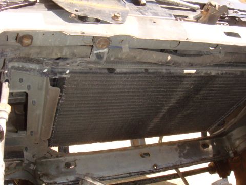 1992 Ford Bronco - The front end of a vehicle, showing the radiator and supporting structure.