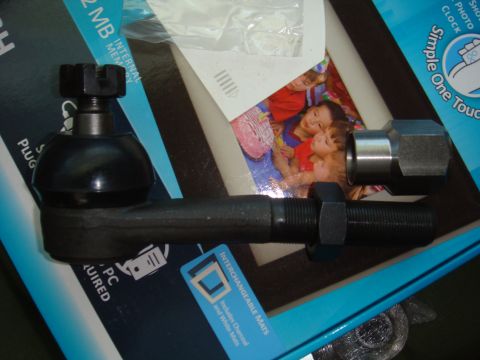 1992 Ford Bronco - A close-up view of a tie rod end assembly, a castle nut and jam nut.