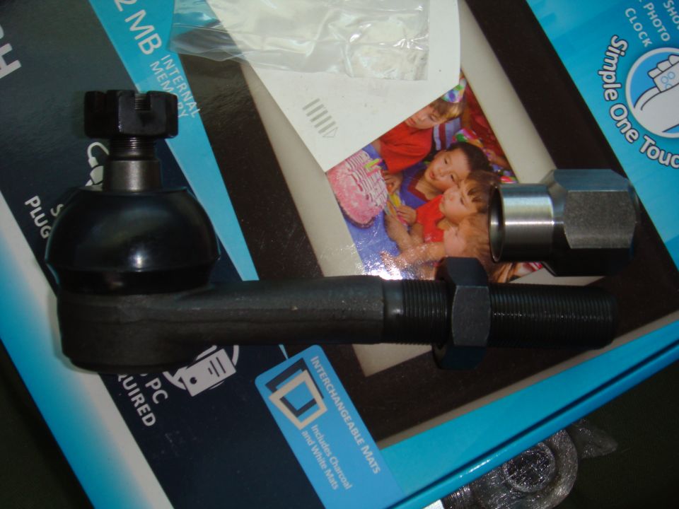 Tie rod end with castle nut and jam nut