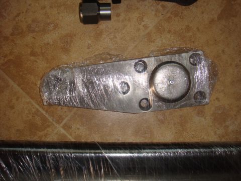1992 Ford Bronco - A metal automotive component is shown, wrapped in protective plastic.