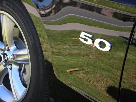1992 Ford Crown Victoria - The reflection on the car's side shows a road and grassy area.