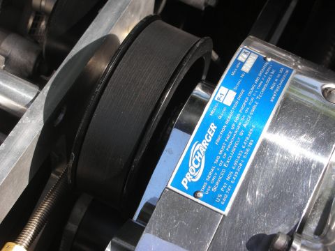 1992 Ford Crown Victoria - Close-up of a ProCharger F-1 supercharger's belt and pulley system.