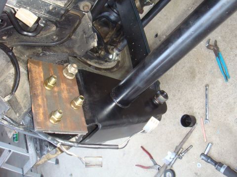 1992 Ford Bronco - Close-up view of custom suspension bracket installation on a vehicle.