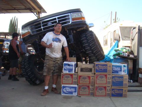 1992 Ford Bronco - Man with a lifted 1992 Ford Bronco and a large collection of beer boxes.