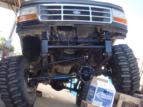 1992 Ford Bronco - Front view of a 1992 Ford Bronco showing its lifted axle and suspension system.