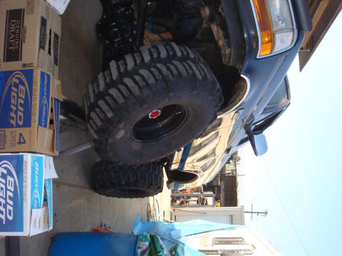 1992 Ford Bronco - This 1992 Ford Bronco features a lifted suspension and aggressive off-road tires, suggesting it's built for challenging terrain.