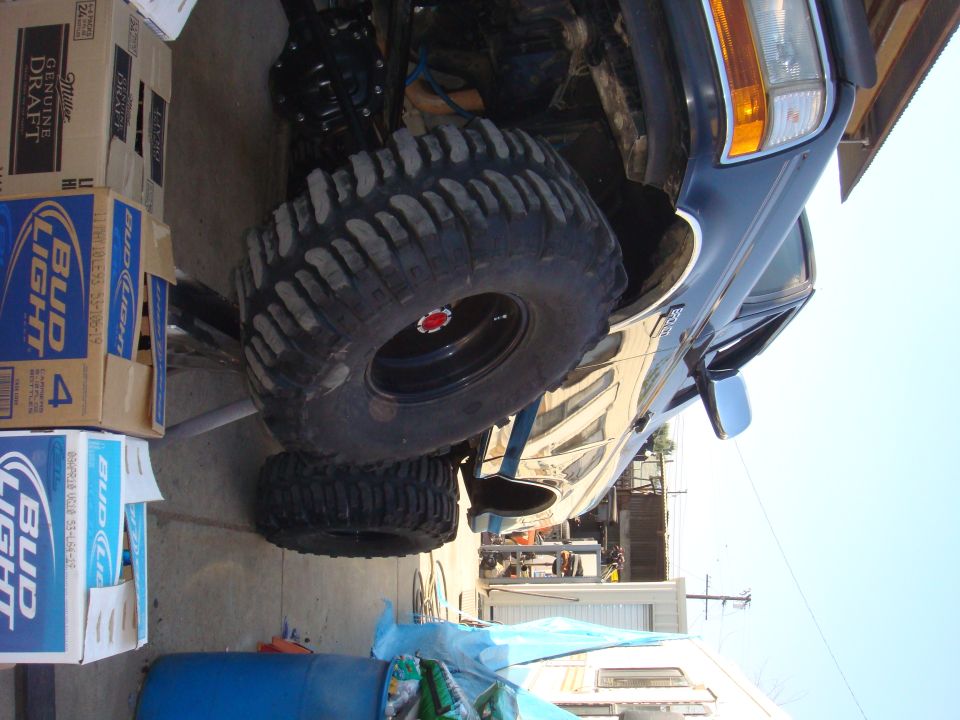 1992 Ford Bronco side view with large off-road tires and lifted suspension