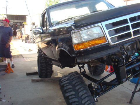 1992 Ford Bronco - This black Ford Bronco is undergoing modifications, a lifted suspension and oversized tires.