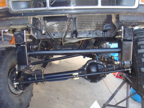 1992 Ford Bronco - Custom front axle and suspension modifications on a 1992 Ford Bronco, heavy-duty components and large off-road tires.