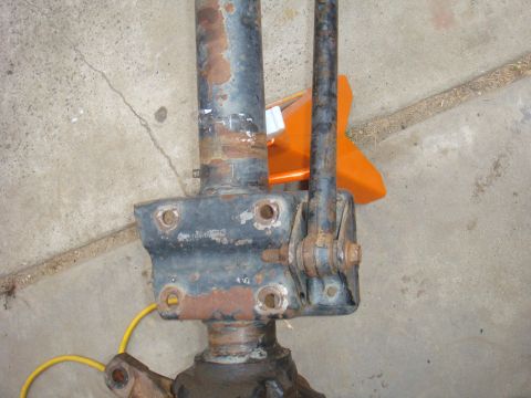 1992 Ford Bronco - This close-up shows a heavily rusted vehicle axle component, likely for a truck or SUV.