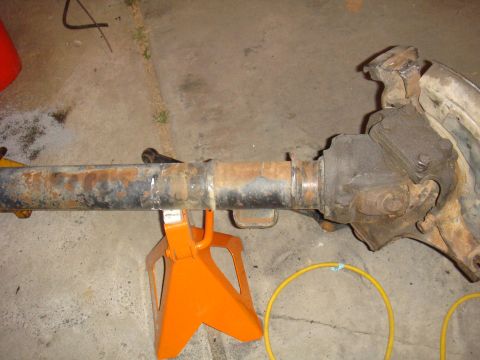1992 Ford Bronco - Axle assembly on jack stands, likely for repair or rebuild.