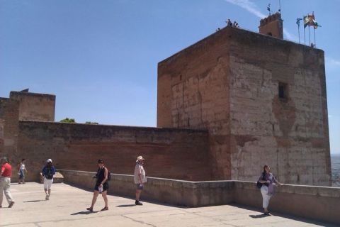 1991 Ford LTD Crown Victoria - Tourists explore the historic Alhambra fortress complex on a sunny day.