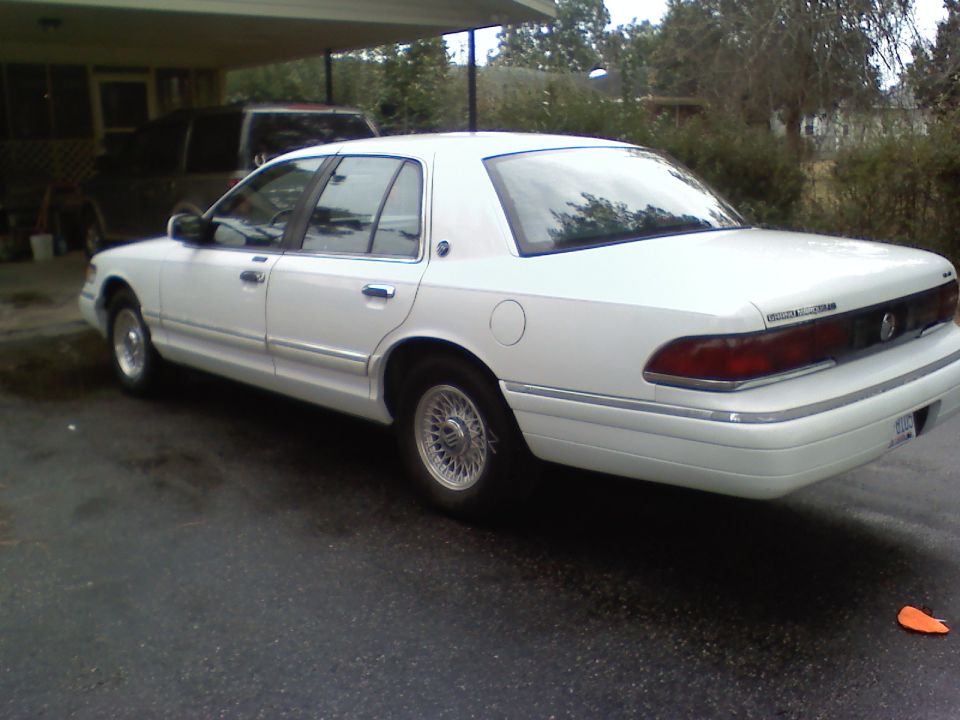 White 1993 Mercury Grand Marquis sedan, rear 3/4 view
