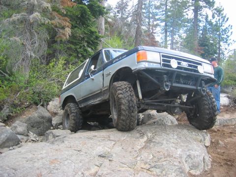 1989 Ford Bronco - Modified 1989 Ford Bronco navigating a rocky off-road course.