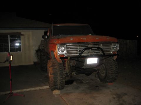 1969 Ford F-250 - This lifted 1969 Ford F-250 features a brush guard and oversized tires, giving it a appearance.