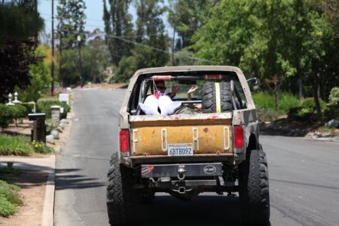 1989 Ford Bronco - This lifted Ford Bronco is equipped with oversized tires and a spare tire mounted in the cargo area.