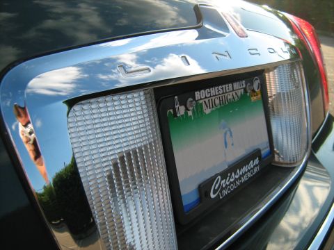1988 Mercury Grand Marquis - Close-up of the rear of a 2001 Lincoln Town Car, showing the taillights and license plate.