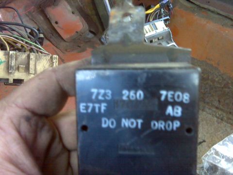 1969 Ford F-250 - Close-up of an electrical relay with visible text and part numbers, likely from a vehicle's electrical system.
