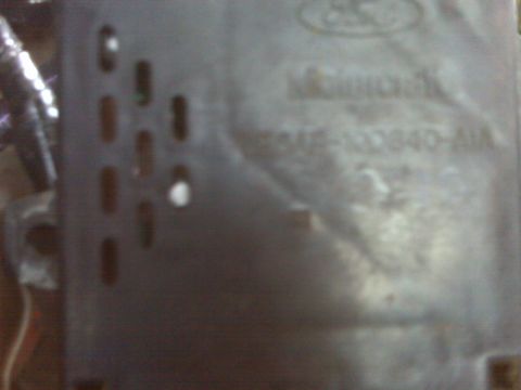 1969 Ford F-250 - Embossed text on a Ford part, possibly a manifold, with a part number visible.