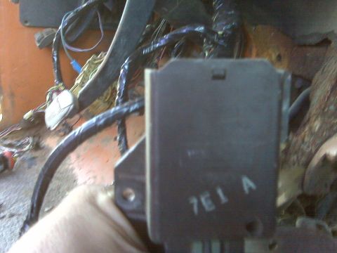 1969 Ford F-250 - A close-up view of a vehicle's interior wiring harness and an electrical component.