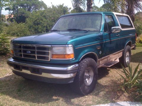1996 Ford Bronco - This 1996 Ford Bronco is a two-tone green and tan SUV with a white roof.