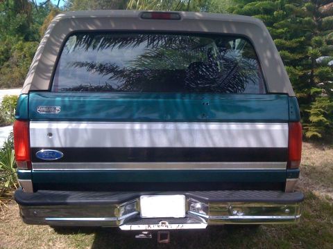 1996 Ford Bronco - The rear of a 1996 Ford Bronco shows its two-tone paint scheme and chrome bumper.