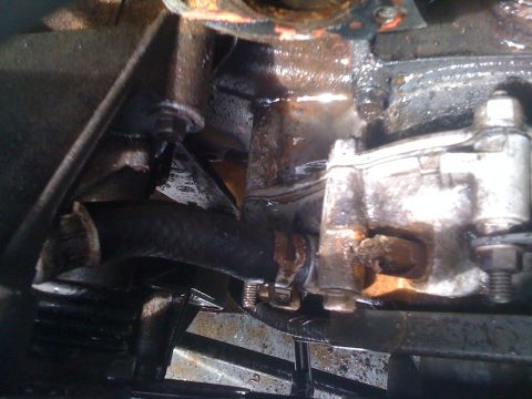 1996 Ford Bronco - Engine component and hose detail, likely from an older vehicle.