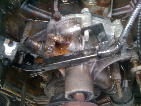 1996 Ford Bronco - A close-up view of an engine part, showing signs of wear and fluid leaks.