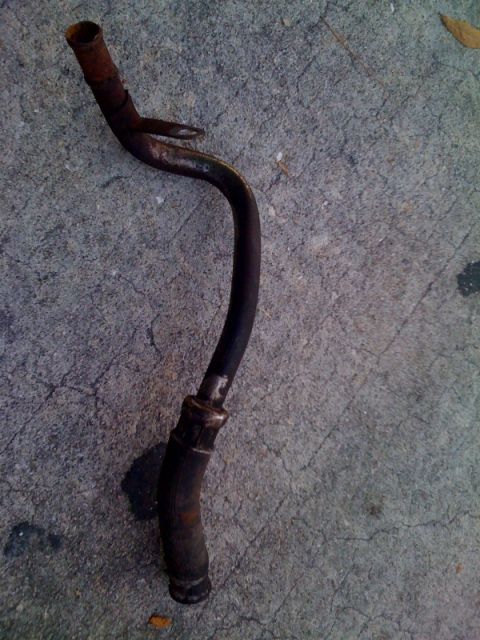 1996 Ford Bronco - This is a rusted metal tube, likely a component from a vehicle.
