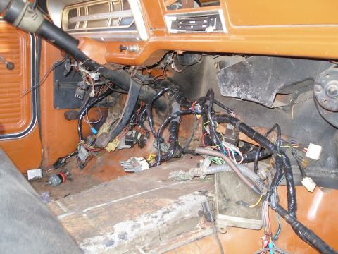 1969 Ford F-250 - The wiring harness is exposed under the dashboard of a 1969 Ford F-250.