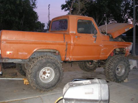 1969 Ford F-250 - This orange pickup truck appears to be from the early 1970s, not a 1969 model.