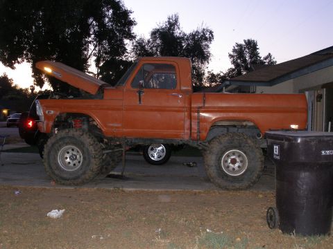 1969 Ford F-250 - This lifted orange pickup truck appears to be a 1967 Ford F-100, not the 1969 F-250 listed in the registry.