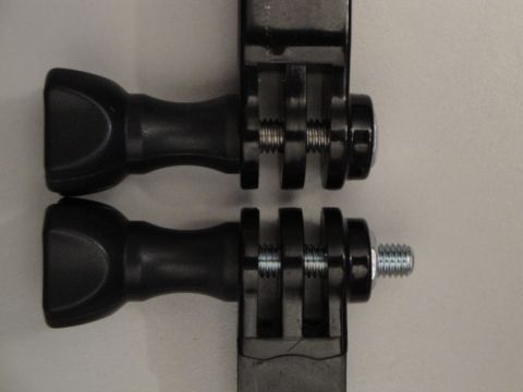 1993 Ford Taurus - Close-up view of two black camera mounting accessories against a neutral background.